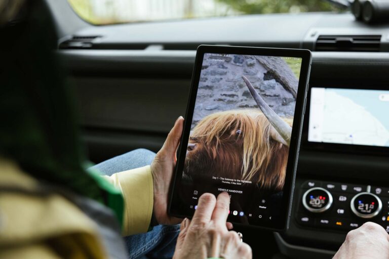 Couple in a Celtic Routes Land Rover viewing the app