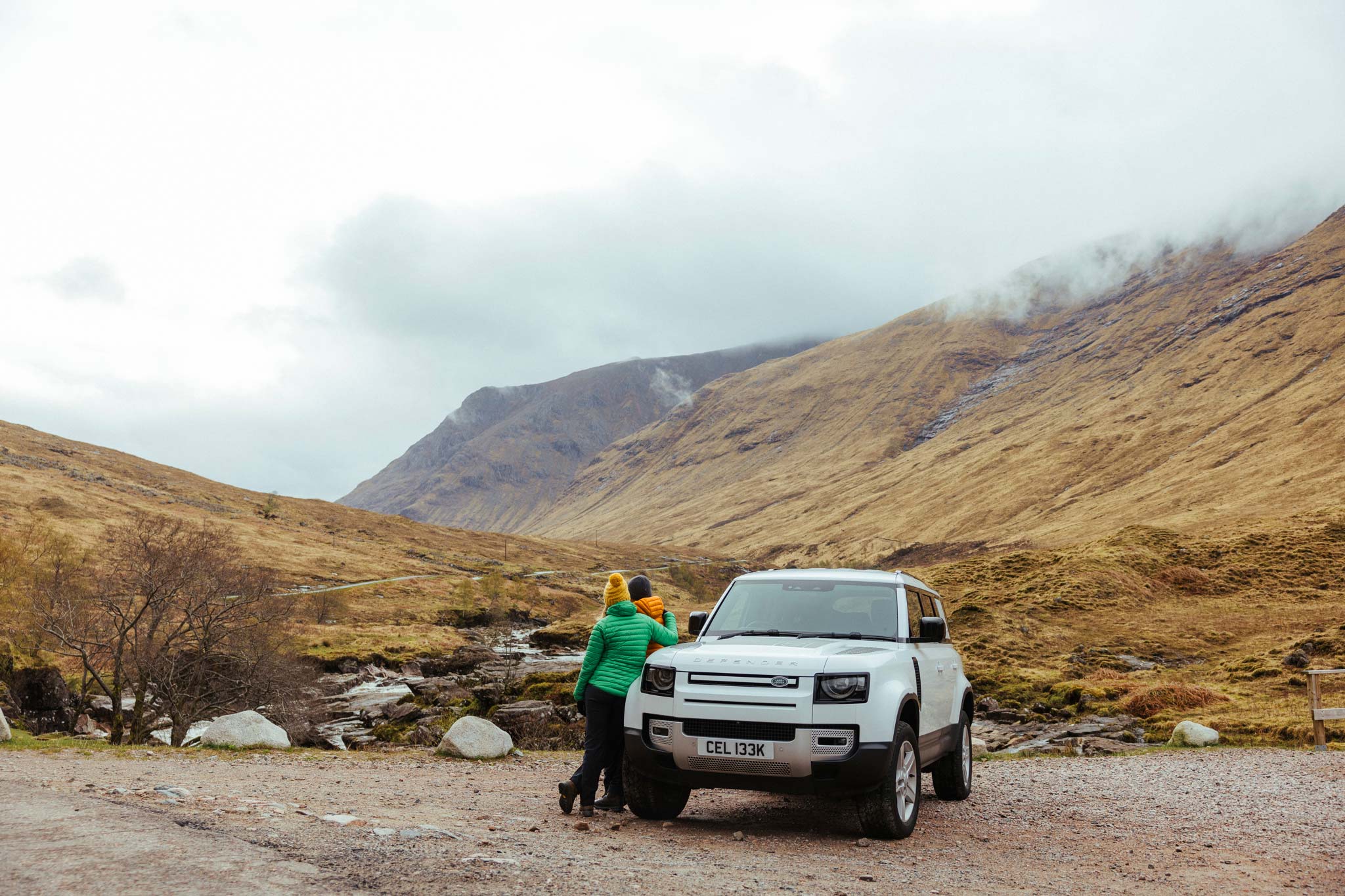 Couple leaning on a Celtic Routes Land Rover