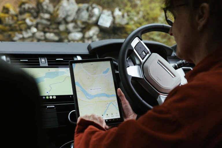Couple in a Celtic Routes Land Rover viewing the app