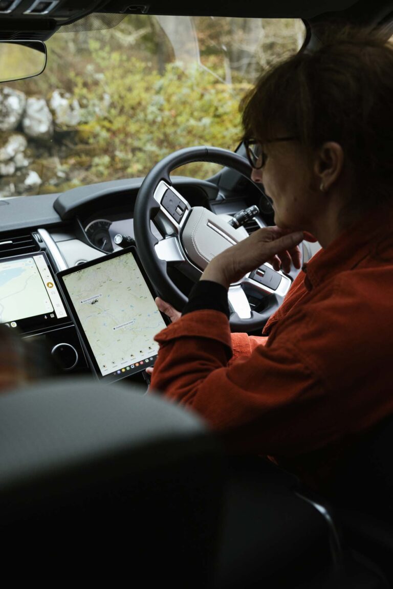 Couple in a Celtic Routes Land Rover viewing the app