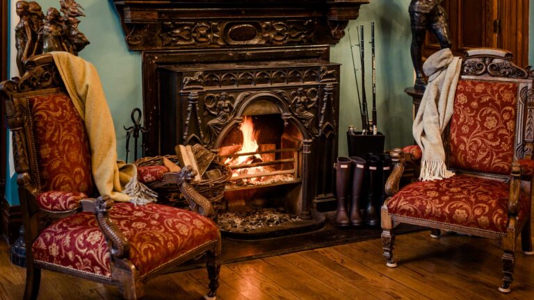 Cahernane Lobby Fireplace with wellies and blankets