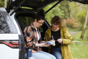 Couple sitting in a Land Rover boot in Scotland