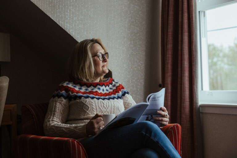Woman reading her Celtic Routes itinerary