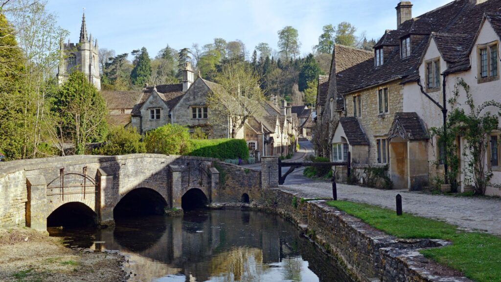 Stone cottages and bridge in Castle Combe in the Cotswolds