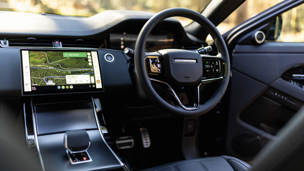 Land Rover interior with steering wheel and navigation display