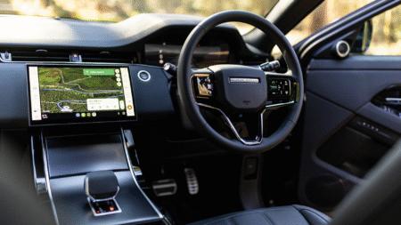 Land Rover interior with steering wheel and navigation display