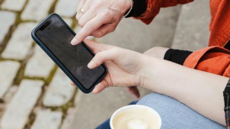 Two people using a smartphone map app