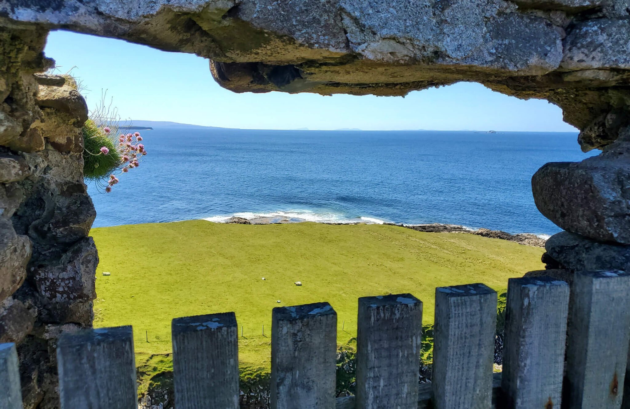 View of the sea through a stone window on the Celtic coast