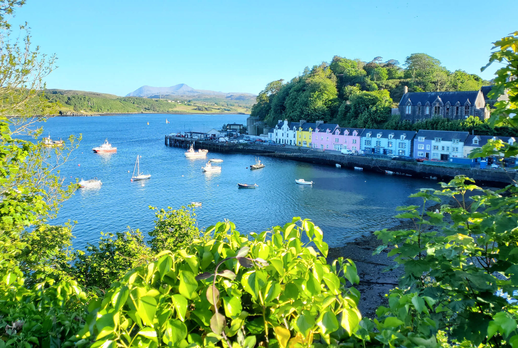Colourful houses and boats in Portree harbour on the Isle of Skye