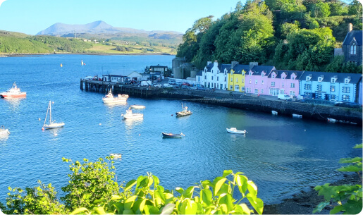 Colourful houses and boats in Portree harbour on the Isle of Skye