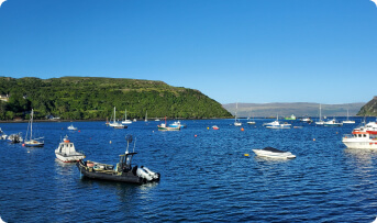 Boats moored in a sheltered Scottish harbour